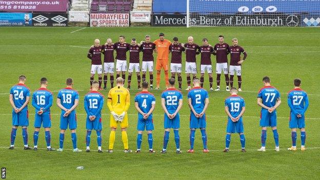 Hearts and Inverness players observe a minute's silence