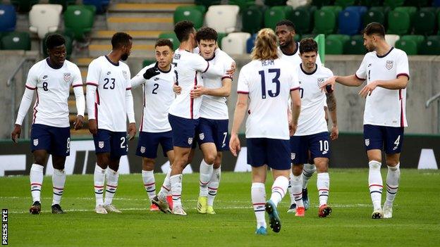 The USA celebrate their first goal against Northern Ireland