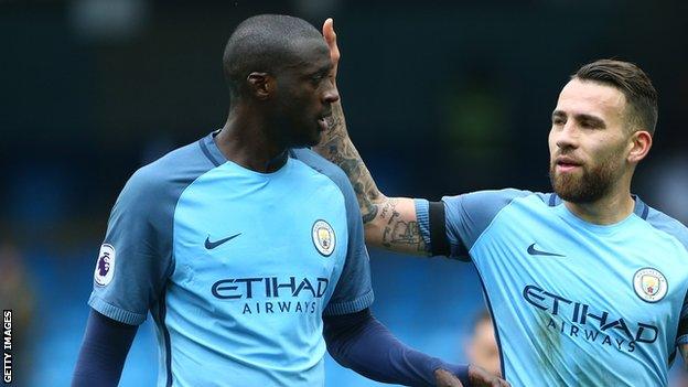 Manchester City midfielder Yaya Toure (right)