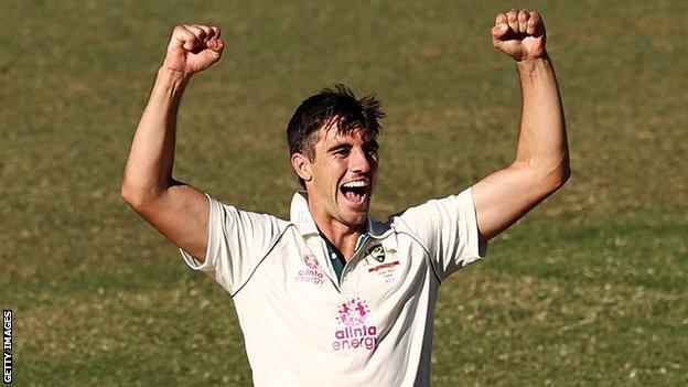 Australia fast bowler Pat Cummins celebrates taking a wicket against India