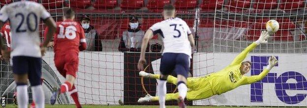 Allan McGregor dives to attempt to save a penalty