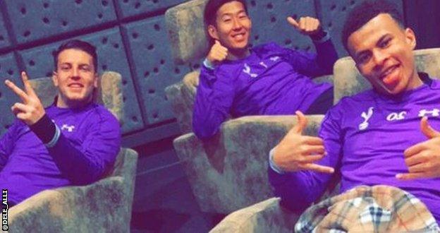 Dele Alli (right) relaxes with team-mates