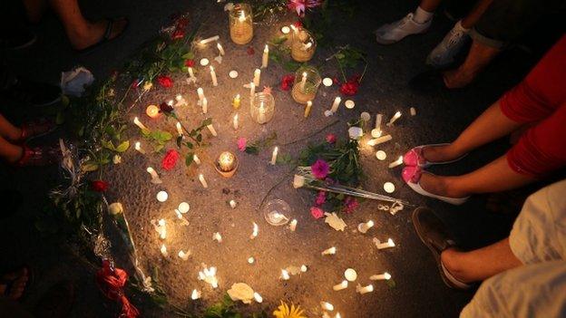 People gather for a candle light rally in solidarity with the victims of a deadly attack on the Imperial Marhabada hotel, in Sousse