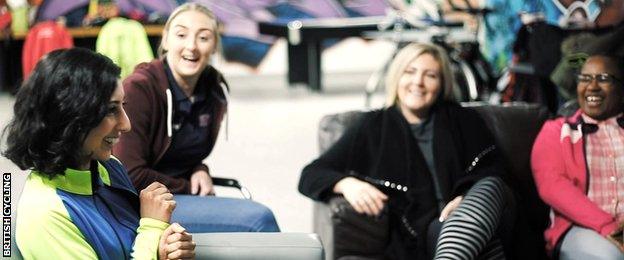 Selma (far left) from Manchester, tells her cycling story to other women