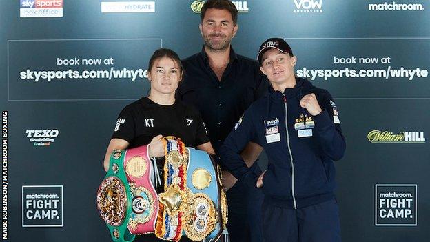 Taylor holds her belts alongside promoter Eddie Hearn and Delfine Persoon