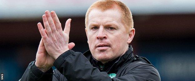 Neil Lennon applauds the travelling Hibernian supporters