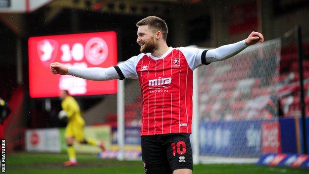 Cheltenham Town striker Alfie May celebrates a goal