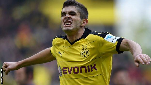 Christian Pusilic's opener helped Borussia Dortmund beat Hamburg