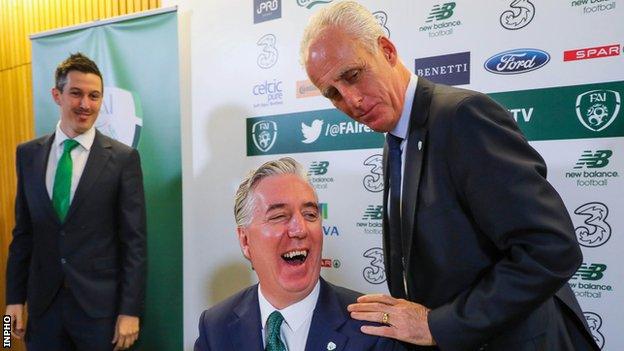 Mick McCarthy shares a joke with FAI chief executive John Delaney at Sunday's news conference in Dublin