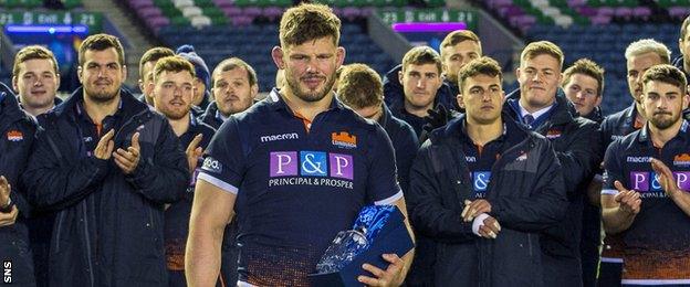 Ross Ford receives an award for his long service to Edinburgh