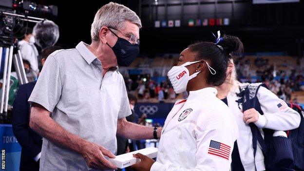 International Olympic Committee president Thomas Bach and American gymnast Simone Biles