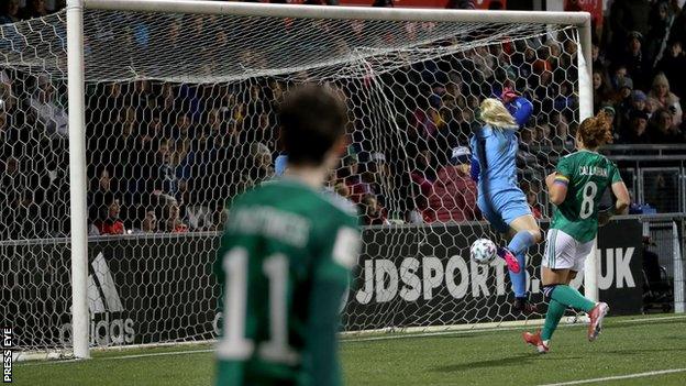 Kirsty McGuinness watches her clip land in the far corner