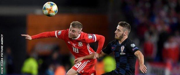 Joe Morrell of Wales beats Croatia's Nikola Vlasic to the ball in October 2019's UEFA Euro 2020 qualifier