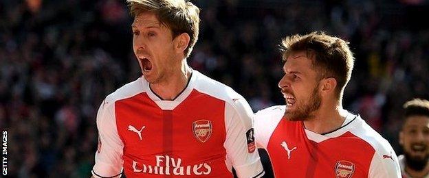 Aaron Ramsey (right) celebrates with Arsenal goal scorer Nacho Monreal