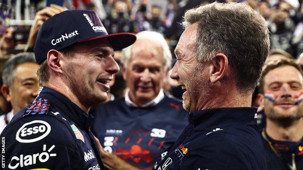 Max Verstappen and Christian Horner celebrate with the Red Bull team