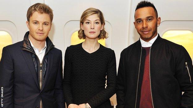 Actress Rosamund Pike separates Nico Rosberg and Lewis Hamilton