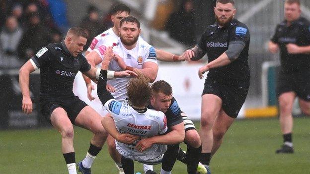 A tackle from Falcons player Callum Chick on Chiefs fullback Josh Hodge results in a red card for Chick during the Gallagher Premiership Rugby match between Newcastle Falcons and Exeter Chiefs