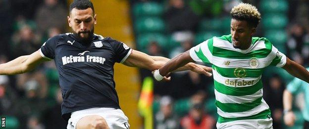 Scott Sinclair is challenged by Steven Caulker