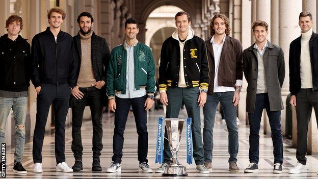 Andrey Rublev, Alexander Zverev, Matteo Berrettini, Novak Djokovic, Daniil Medvedev, Stefanos Tsitsipas, Casper Ruud and Hubert Hurkacz pose with the ATP Finals trophy in Turin