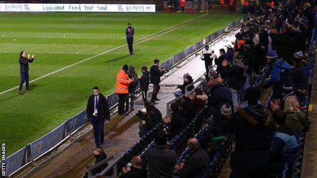 Wycombe manager Gareth Ainsworth (left) receives adulation from the club's fans