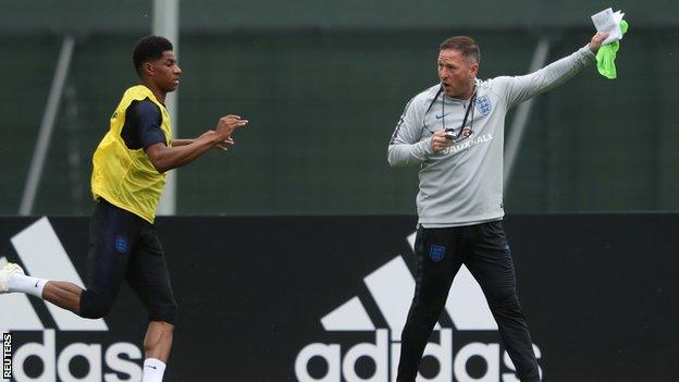 England assistant manager Steve Holland was seen clutching training notes on Thursday