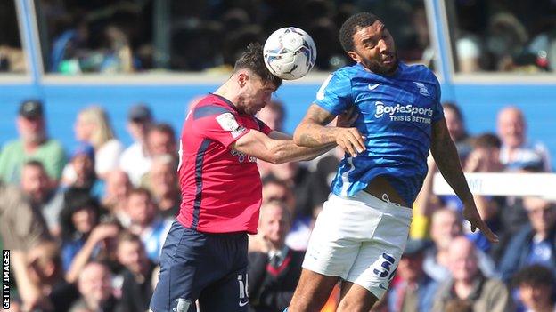 Hughes and Deeney challenge for the header