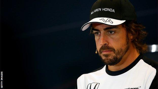 Fernando Alonso looking glum