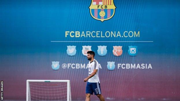 Sergio Aguero trains at Barcelona's base while with Argentina