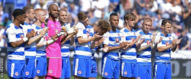 Reading players during a minute's applause in memory of Eamonn Dolan