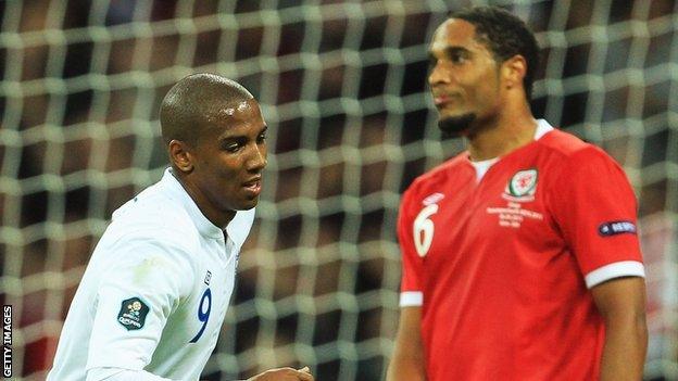 Ashley Young celebrates England's winner against Wales in September 2011