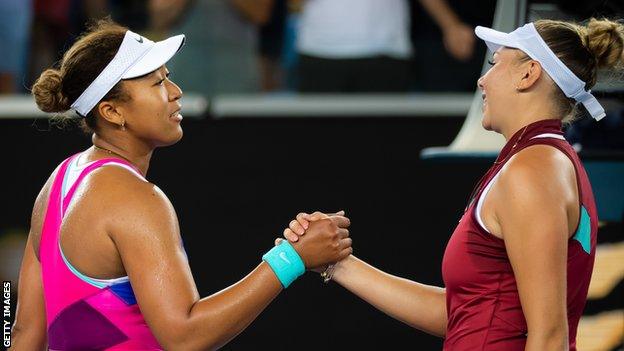 Naomi Osaka shakes hands with Amanda Anisimova after their Australian Open match