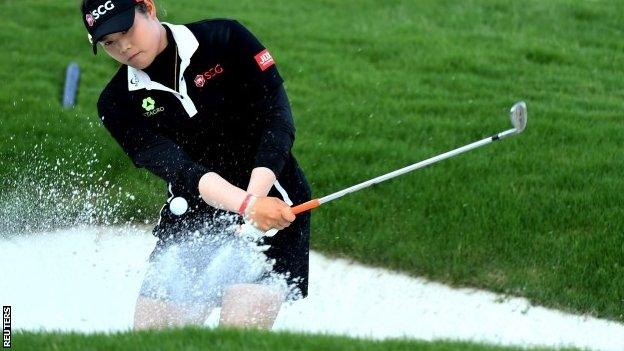 Thailand's Ariya Jutanugarn playing out of a bunker on the 18th hole