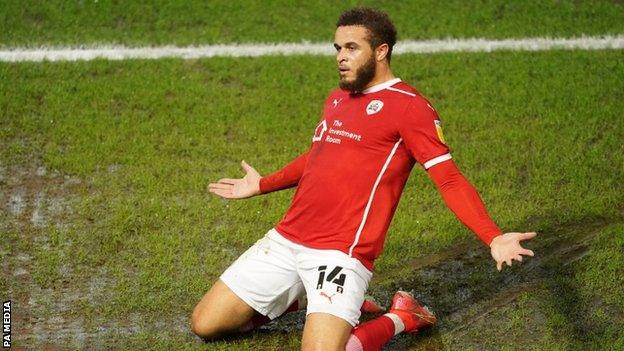 Carlton Morris celebrates scoring Barnsley's first goal