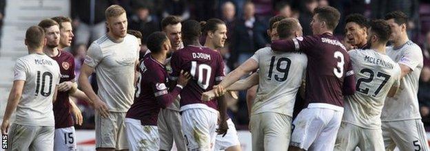 Hearts and Aberdeen players confront each other