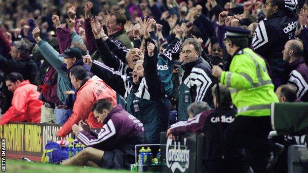 Kevin Keegan slumps over advertising boards after his Newcastle team lose 4-3 in the final minite at Anfield