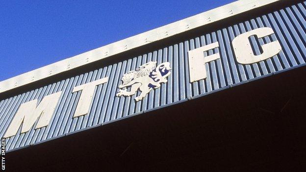 Macclesfield Town's FA Cup tie against Kingstonian on Sunday is at risk after the club's players went on strike