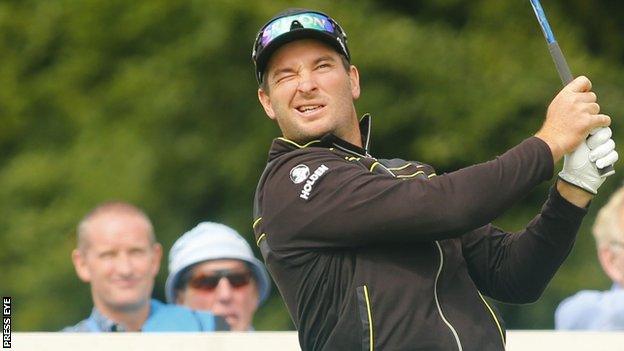 Ryan Fox watches the flight of his opening tee shot at Galgorm Castle on Sunday