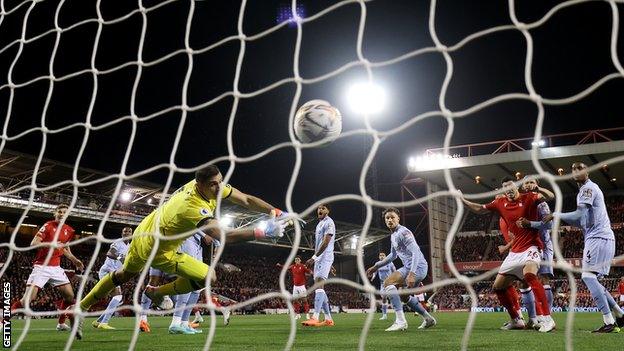 Emmanuel Dennis scores