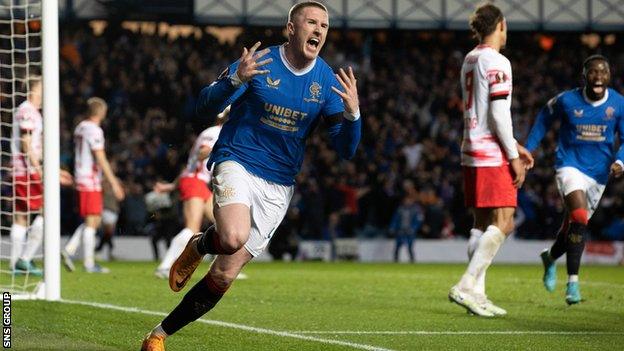 John Lundstram celebrates scoring the decisive goal for Rangers at Ibrx