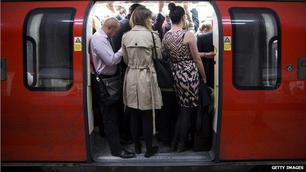 Commuters on a Tube