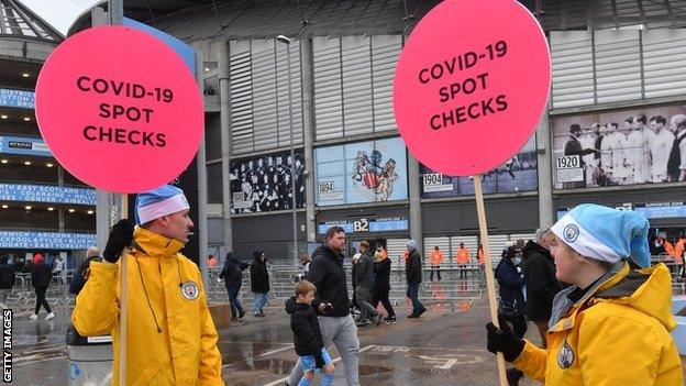 Covid signs at Man City