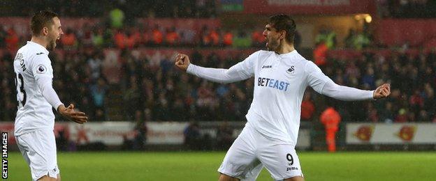 Gylfi Sigurdsson and Fernando Llorente