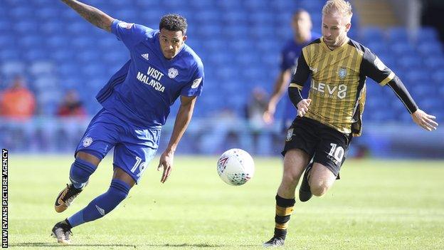 Nathaniel Mendez-Laing of Cardiff City gets away from Barry Bannan of Sheffield Wednesday