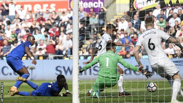 Kyle Naughton scores an own goal just before half-time