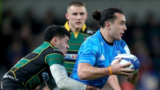 Leinster wing James Lowe is tackled by Northampton's Connor Tupal at the Aviva Stadium