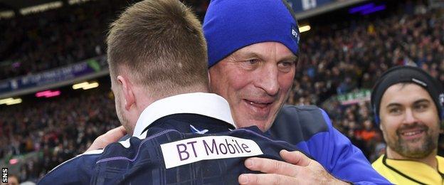 Scotland coach Vern Cotter hugs full-back Stuart Hogg in celebration after the victory over Wales