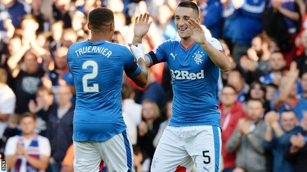 James Tavernier and Lee Wallace embrace