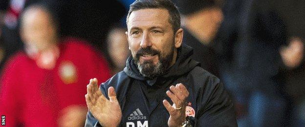 Derek McInnes celebrates Aberdeen's victory over Ross County