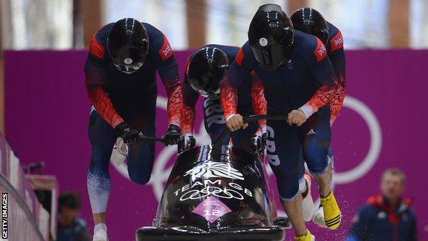 John James Jackson, Stuart Benson, Bruce Tasker and Joel Fearon of Great Britain make a run during the Men's Four-Man Bobsleigh on Day 16 of the Sochi 2014 Winter Olympics