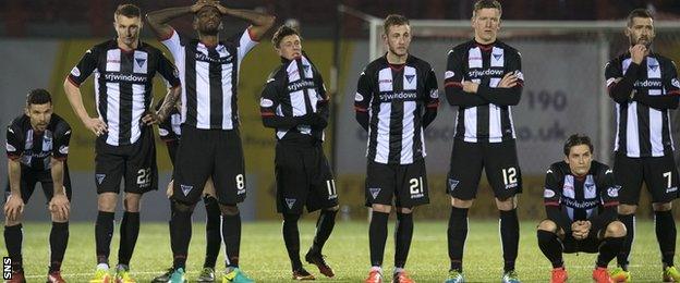 Dunfermline's players watch the penalty shoot-out in horror